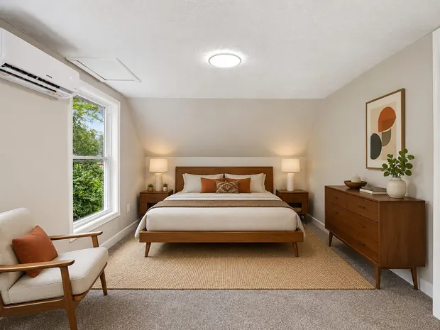 The same bedroom staged in a mid-century style